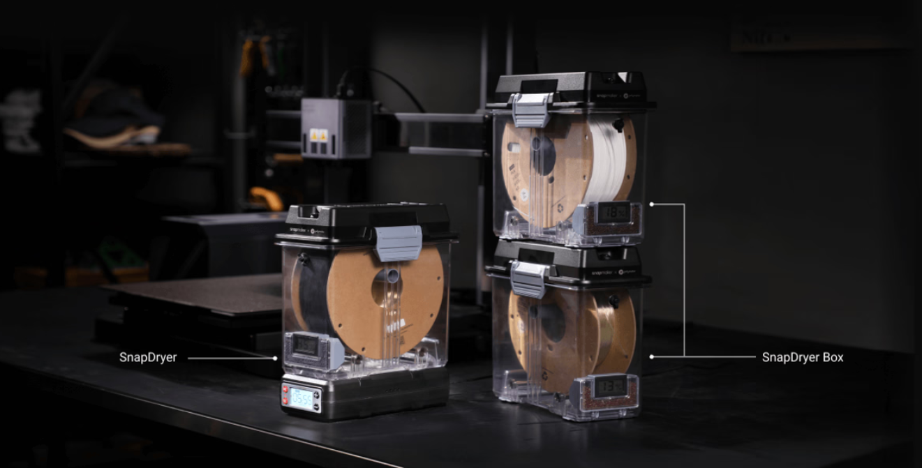 The Snapmaker SnapDryer and stackable SnapDryer Box, two purpose-built filament dryers that also function as humidity-controlled storage.