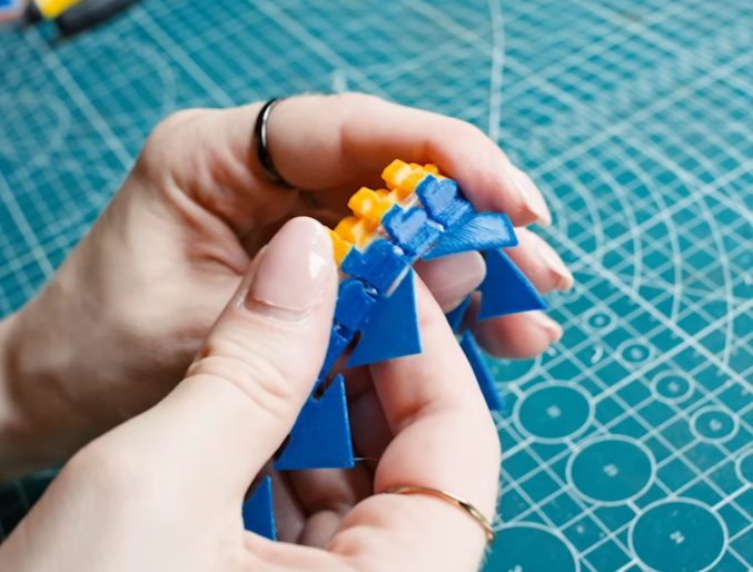 3D printed interlocking parts demonstrating a transition fit with slight friction.