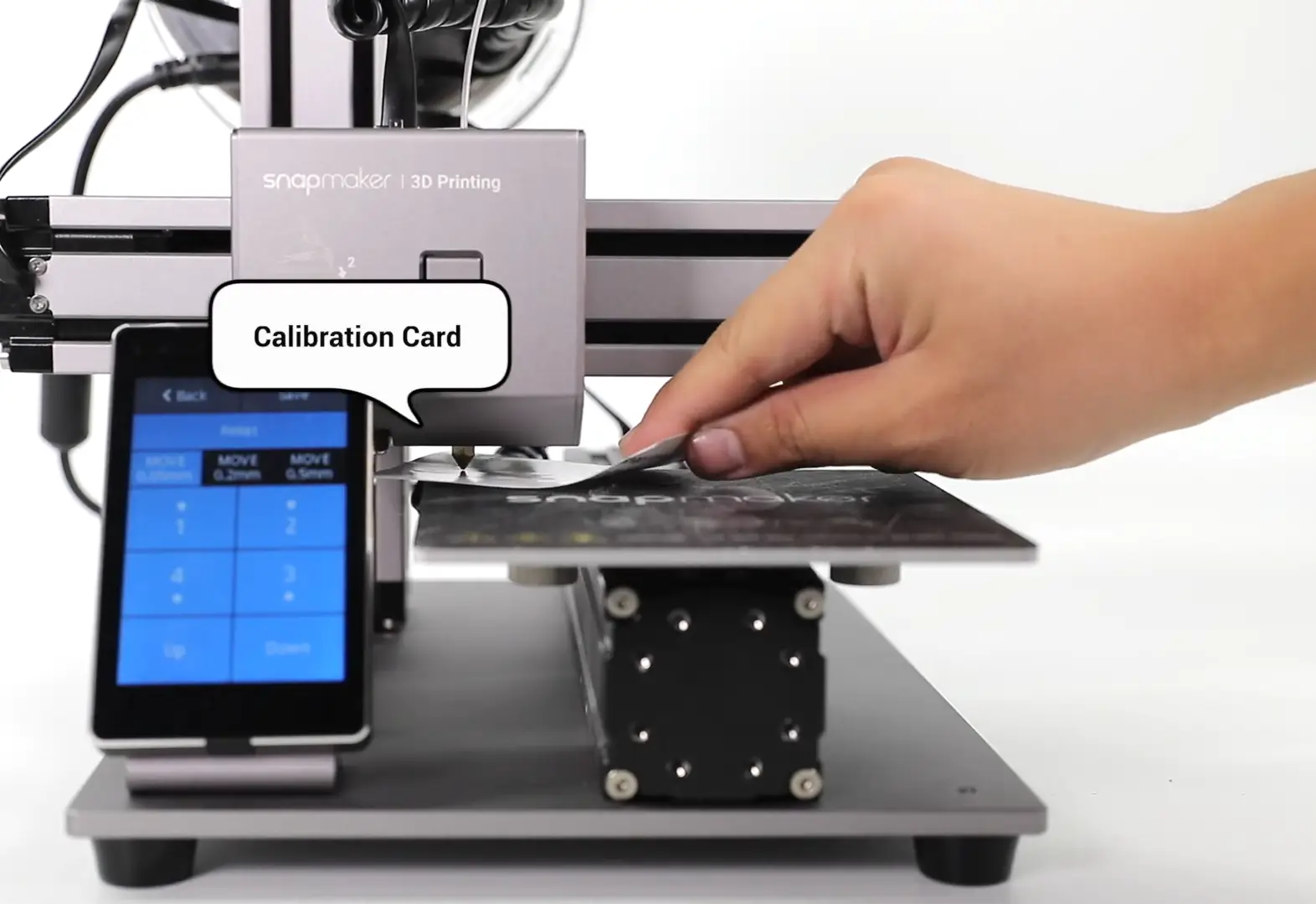 Using a calibration card to adjust the Z-offset on a Snapmaker 3D printer nozzle, ensuring the correct gap for the first layer.