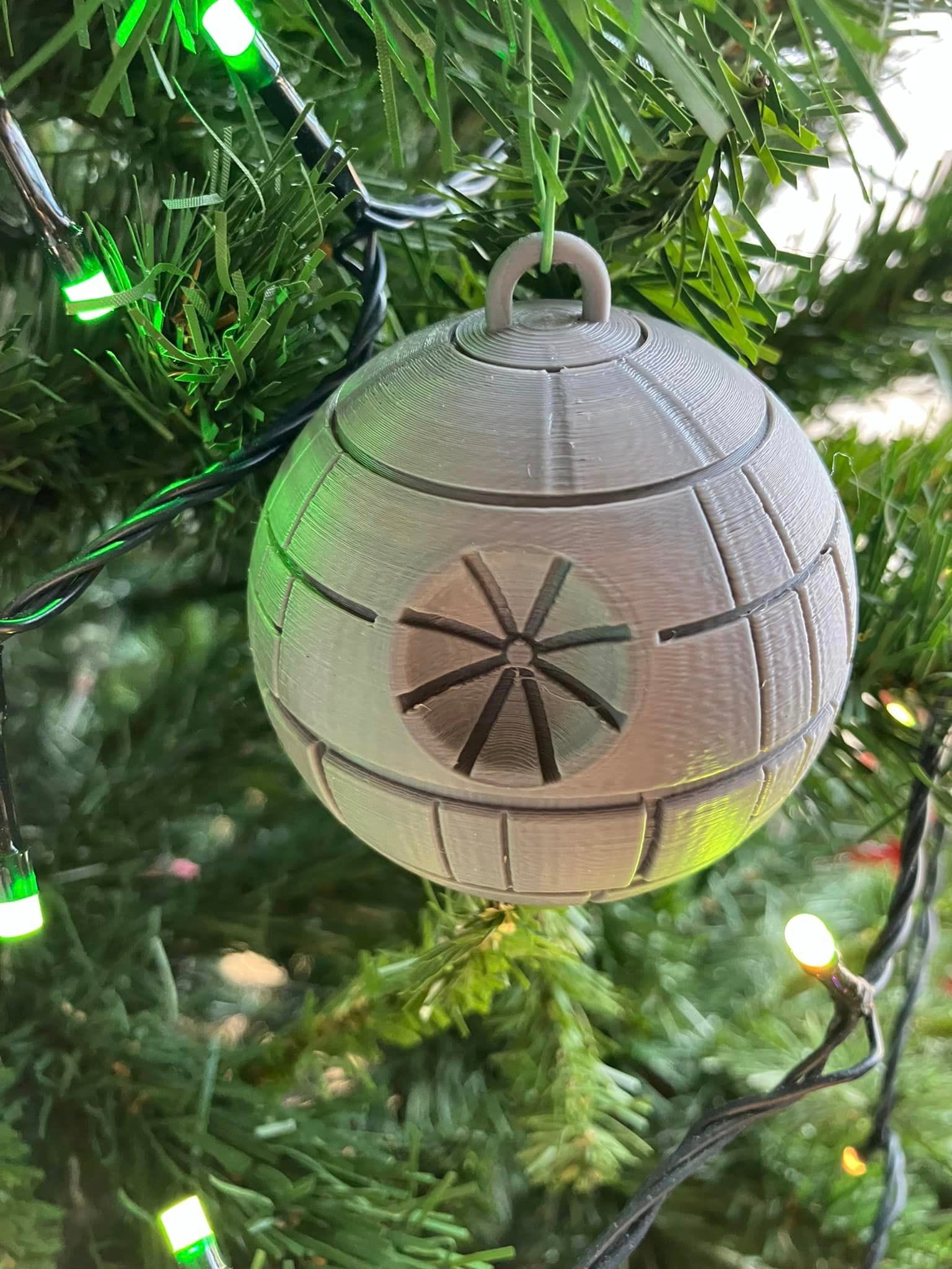 a custom 3D-printed Christmas tree ornament designed to represent the Death Star from Star Wars