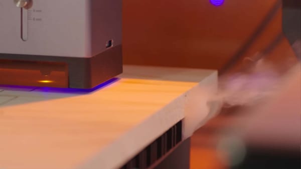 Snapmaker laser engraver is working, the laser fume is retained within the enclosure.